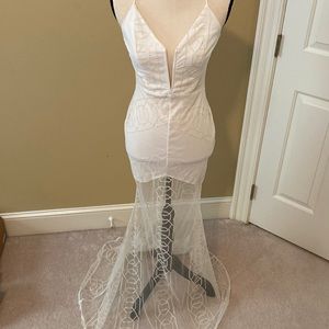 Long off white sheer gown.